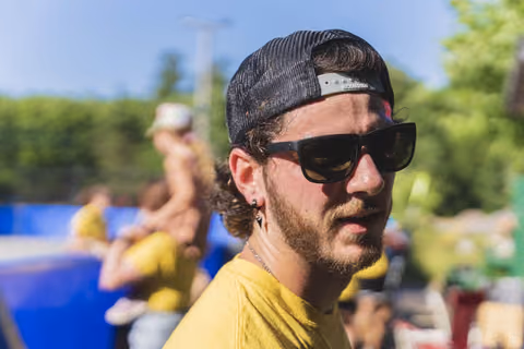 A camp director wearing sunglasses